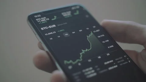 Smartphone Bitcoin exchange - stock market Stock Footage