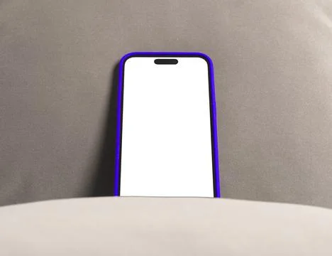 Smartphone with blank screen in a blue case on a gray surface. Vertical mob.. Stock Photos