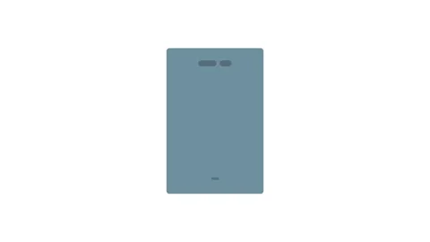 A smartphone with a blank screen facing forward, resting on a flat surface. Stock Footage 334021193