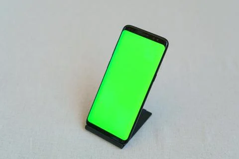 Smartphone with blank screen standing on table Stock Photos