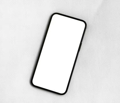 Smartphone with a blank white screen tilted on a light grey background, vie.. Stock Photos