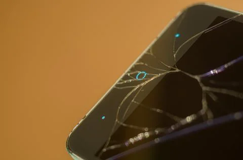 Smartphone with broken display glass. Cracked screen glass. Broken phone Stock Photos