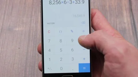 The Smartphone calculator. Count numbers digits on a calculator on a smartphone. Stock Footage 171623746
