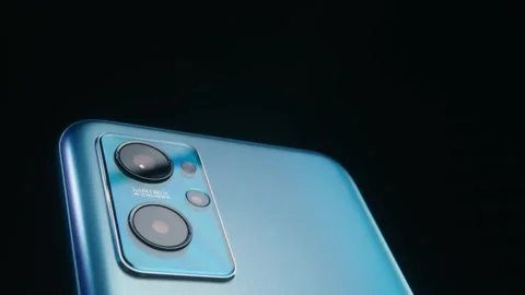 Smartphone camera lens close-up on a dark background plays with light. Stock Footage 169689989