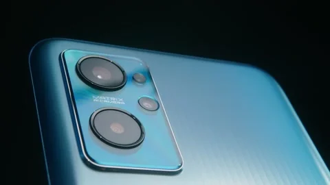 Smartphone camera lens close-up on a dark background plays with light.#3 Stock Footage 169690036