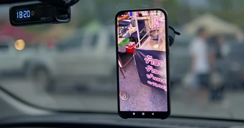 Smartphone capturing street market activity urban setting mobile real-time view Stock Footage 334635691