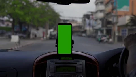 Smartphone in a car use for Navigate or GPS. Driving a car with Smartphone in ho Stock Footage 170589209