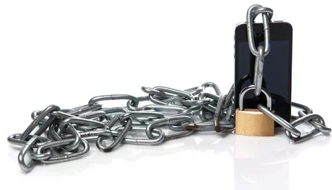 Smartphone, chain and padlock Stock Photos