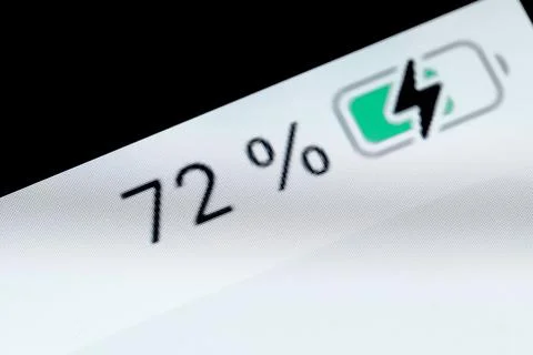 Smartphone charged battery level indicator - 72 percent: close up macro Stock Photos