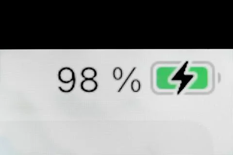 Smartphone charged battery level indicator - ninety-eight, 98 percent: close up Stock Photos
