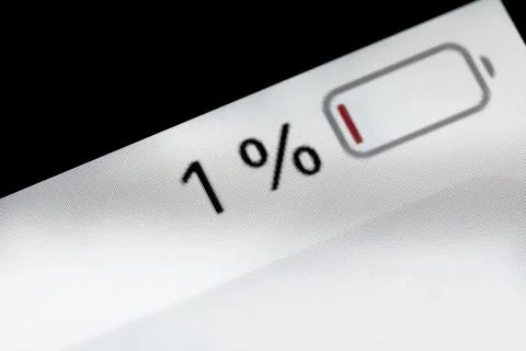Smartphone charged battery level indicator - one, 1 percent: close up macro Stock Photos
