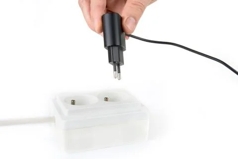 Smartphone charger plug in the socket Stock Photos