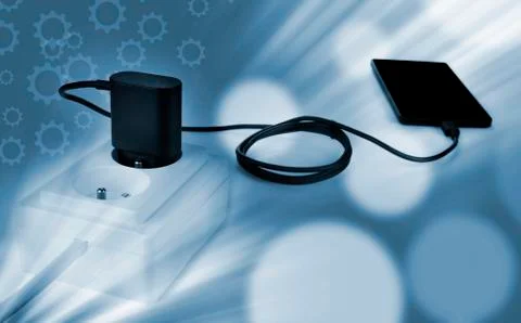 Smartphone charger plug in the socket Stock Photos