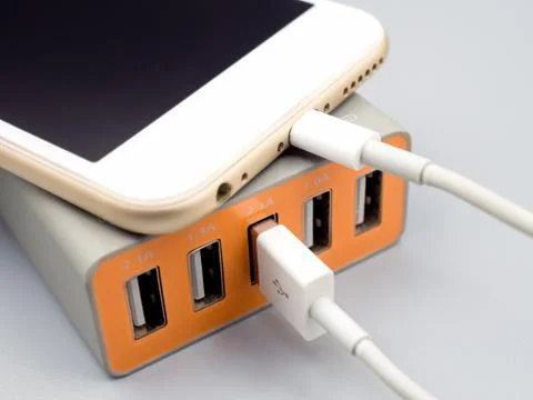 Smartphone charging with multiport USB power adaptor Stock Photos