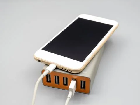Smartphone charging with multiport USB power adaptor Stock Photos