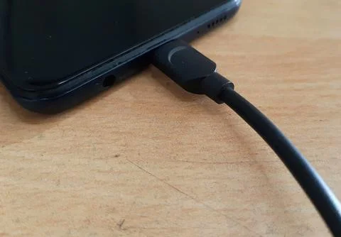 Smartphone charging Stock Photos