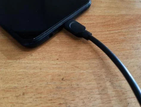 Smartphone charging Stock Photos
