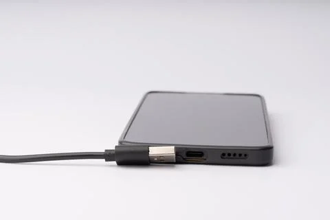 Smartphone Charging with USB Cable in Closeup Stock Photos