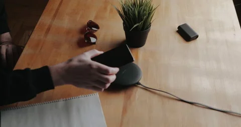 Smartphone Charging With Wireless Charger	 Stock Footage 143558549