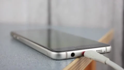 Smartphone charging.Phone charging cable close-up. Stock Footage 193498797