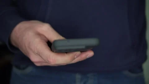 Smartphone Check, Guy Takes Phone From Jeans Pocket for a Quick View and Puts Stock Footage 330849841