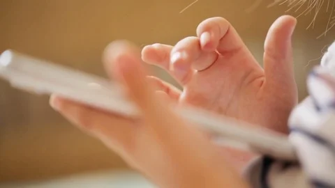 The smartphone in child's hands Video stock 76365447