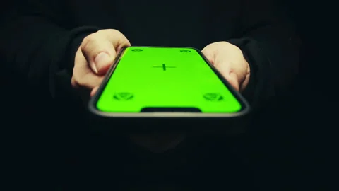 Smartphone with chroma key screen on black background close-up. Green screen on Stock-Footage 272481002