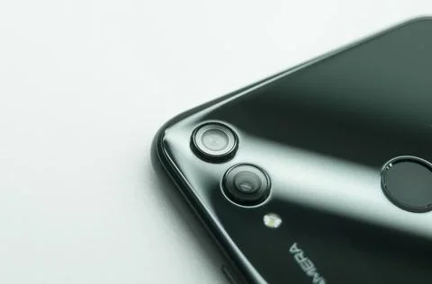 Smartphone close-up. Dual main camera mobile phone. Selective focus, white Stock Photos