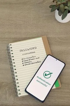 Smartphone Confirming Authentication Success Over Password Security Notes Stock Photos