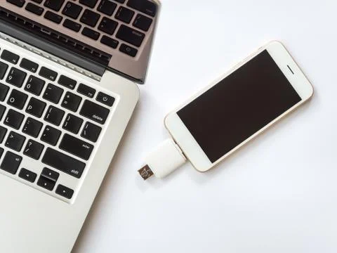 Smartphone connected with external storage and laptop Stock Photos