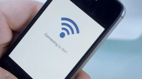 Smartphone connecting to WiFi signal in hand Stock Footage