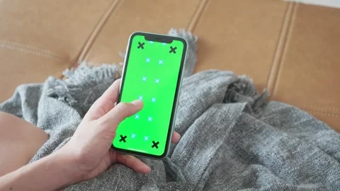 Smartphone on Couch with Green Screen Display Stock Footage 315975352