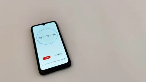 Smartphone Countdown Timer Running on Light Wooden Surface Video stock 330051199