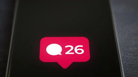 Smartphone on a desk showing comment countter popup notification closeup shot 4k Stock Footage 157973017