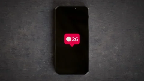 Smartphone on a desk showing comment countter popup notification 4k Stock Footage 158687164