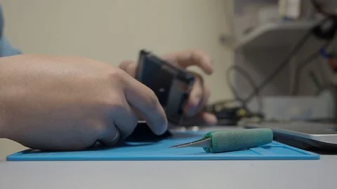Smartphone disassembling in repair shop Stock Footage 113675268