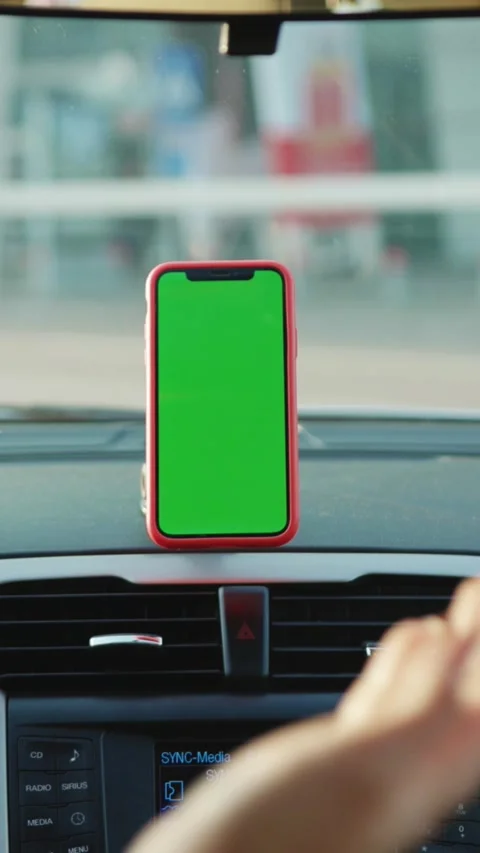 A smartphone display featuring a vibrant green screen has been placed within a Stock Footage 314170219