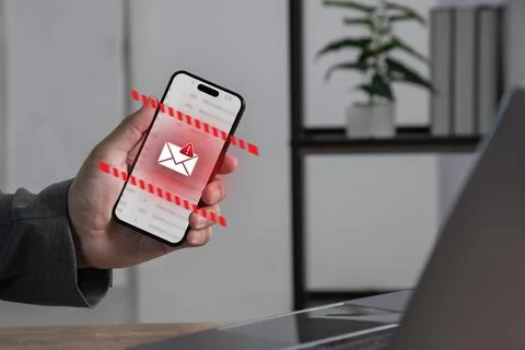 Smartphone displaying email security alert with warning phishing detection .. Stock Photos