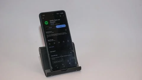 Smartphone Displaying Google Play Store After Spotify Download Stock Photos