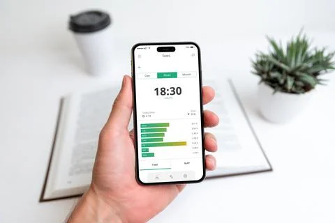 Smartphone displaying learning progress tracking app, monitoring study time Stock Photos