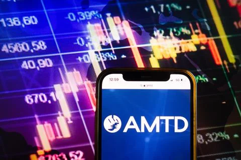 Smartphone displaying logo of AMTD Group Stock Photos
