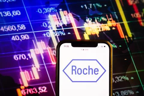 Smartphone displaying logo of F. Hoffmann- La Roche company Stock Photos