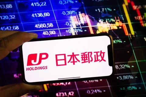 Smartphone displaying logo of Japan Post Holdings Stock Photos