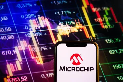 Smartphone displaying logo of Microchip Technology Stock Photos