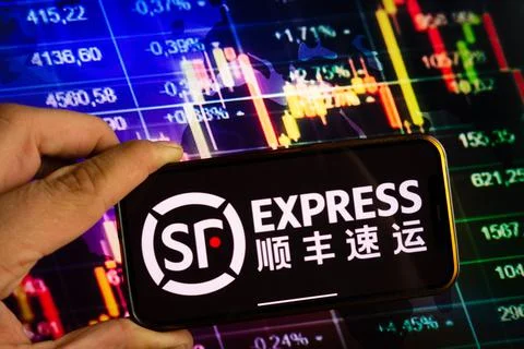 Smartphone displaying logo of SF Express Stock Photos