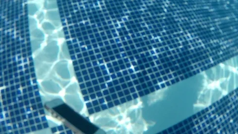 Smartphone is drop and thrown into the pool water. Stock Footage 81358986