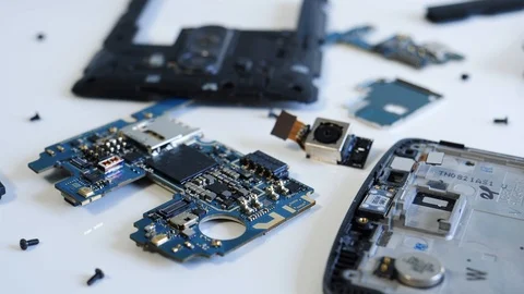 Smartphone Electronic Internals on a Table For Repair Stock Footage 89560409