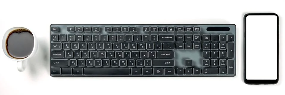 Smartphone with empty display screen, cup of black coffee and black pc keyboard Stock Photos