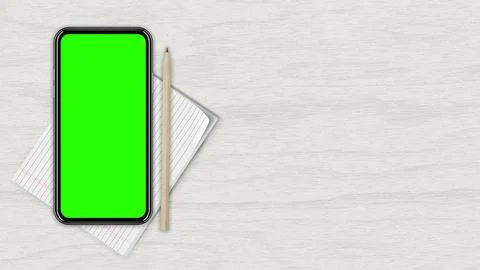 Smartphone with an empty green screen, top view, against a white wood countertop Stock Illustration