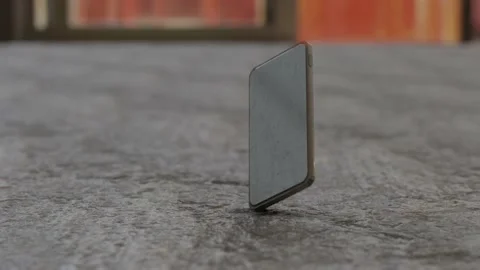 Smartphone falling and cracking after hitting the floor in slow motion Stock Footage 165252009